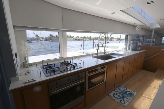 The kitchen boasts a unique view and a sliding window.