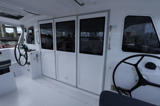 The cockpit is sheltered and the berth attaches to the ceiling to create a large living space.