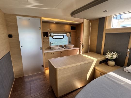 On portside, the master cabin features a head with a double sink vanity, a large shower and toilet.