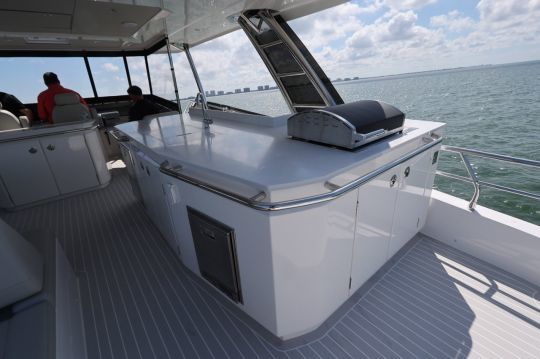 The flybridge features a large outdoor galley